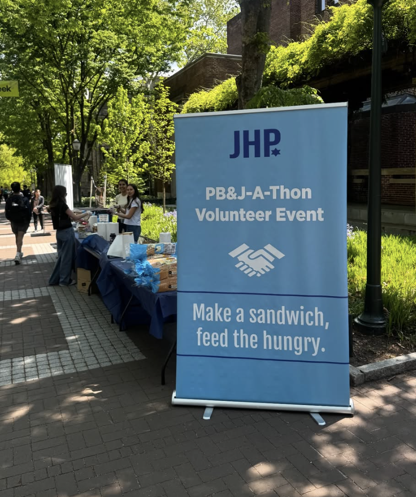 JHP PB&J-A-Thon volunteer event sign in the center of Penn's campus