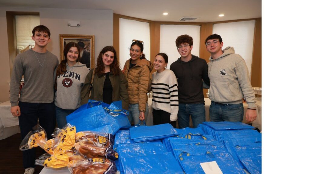 JHP Penn students preparing challah and wine deliveries for Shabbat for 1K dinners across campus